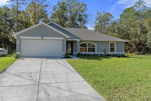 ranch-style house with a garage and a front lawn