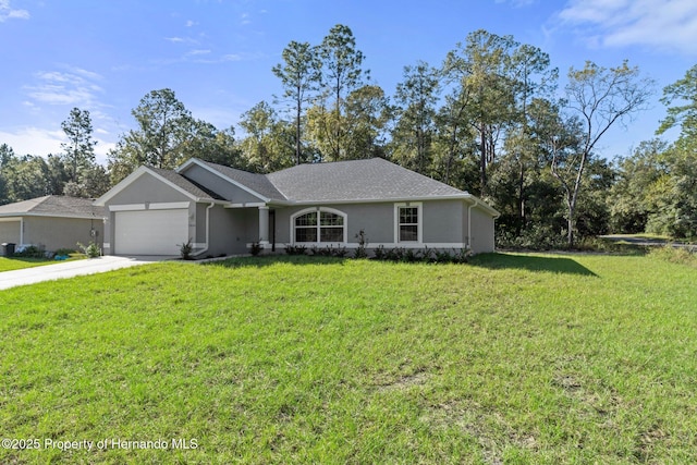 ranch-style house featuring a garage and a front yard