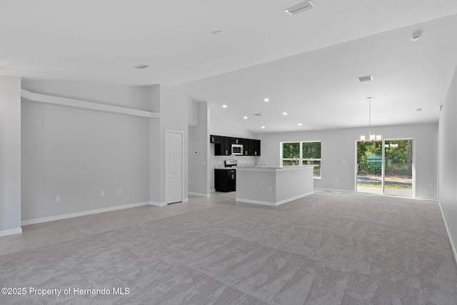 unfurnished living room with light carpet, vaulted ceiling, and a notable chandelier