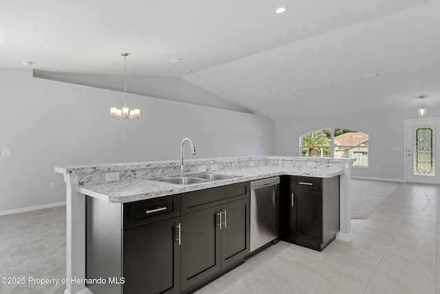 kitchen featuring a notable chandelier, dishwasher, sink, pendant lighting, and lofted ceiling