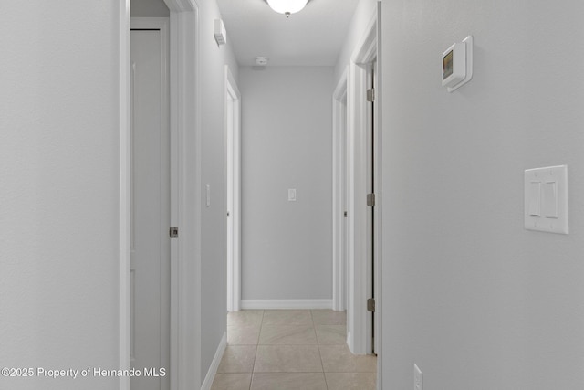 hallway featuring light tile patterned floors