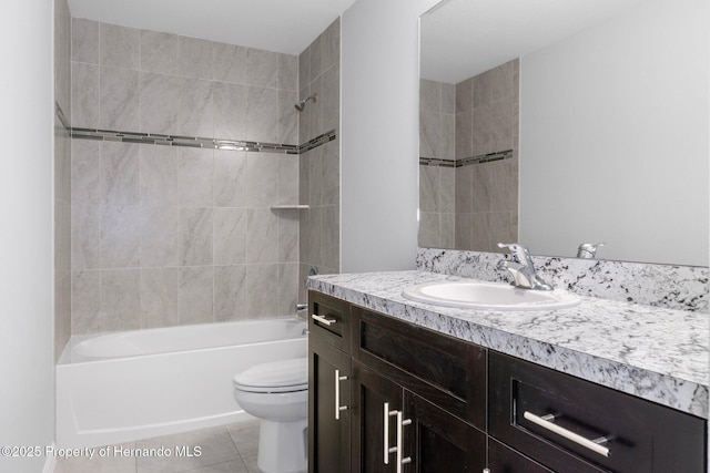 full bathroom featuring vanity, bathing tub / shower combination, tile patterned flooring, and toilet