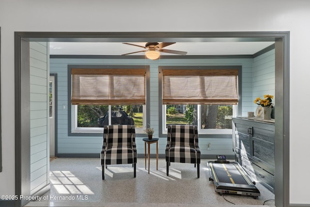 interior space featuring ceiling fan