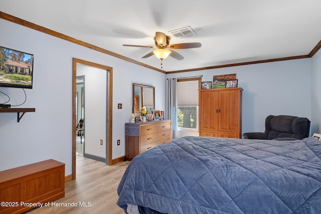 bedroom with light hardwood / wood-style flooring, ornamental molding, and ceiling fan