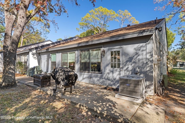 back of property featuring central AC unit and a patio area