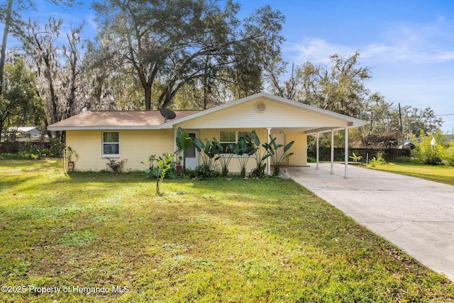 ranch-style house with a carport and a front yard