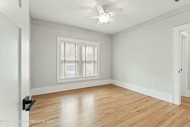 empty room featuring ceiling fan and wood-type flooring