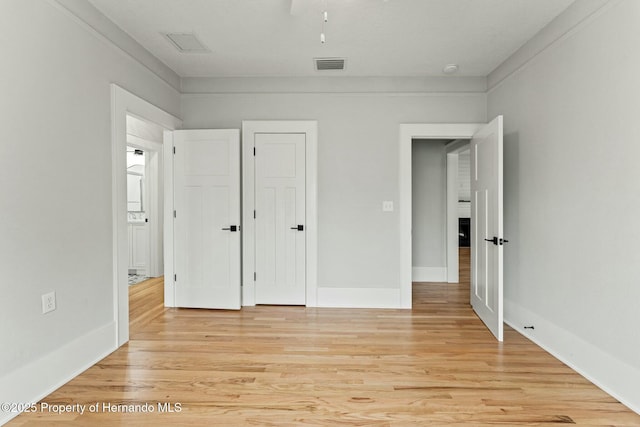 unfurnished bedroom with light hardwood / wood-style floors