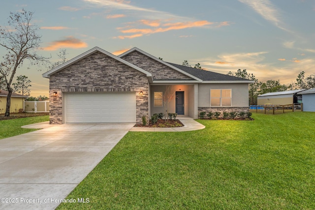 craftsman inspired home with a garage and a lawn