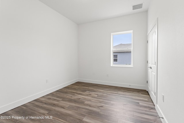 spare room featuring hardwood / wood-style floors