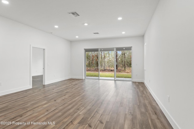 spare room featuring hardwood / wood-style floors