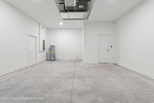 garage with electric panel and electric water heater