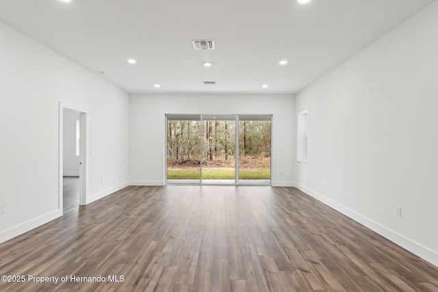 empty room featuring dark hardwood / wood-style floors