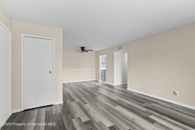 unfurnished room with wood-type flooring and ceiling fan