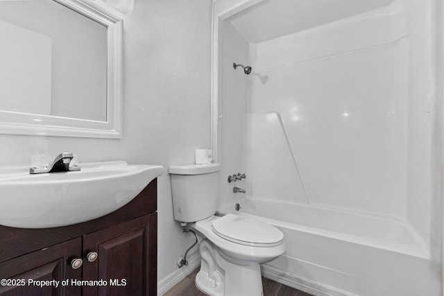 full bathroom featuring vanity, toilet, and washtub / shower combination