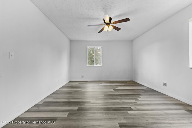 unfurnished room with wood-type flooring, ceiling fan, and a textured ceiling