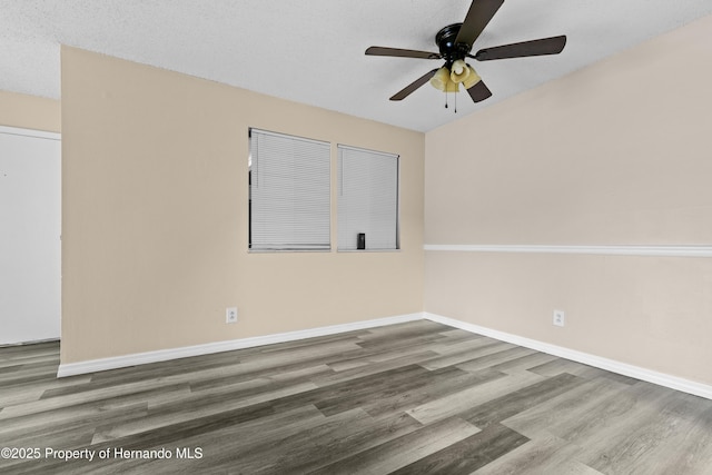 unfurnished room with wood-type flooring and ceiling fan