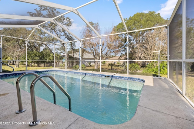 view of pool with a lanai and a patio area