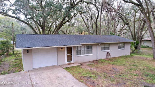 ranch-style house featuring a garage