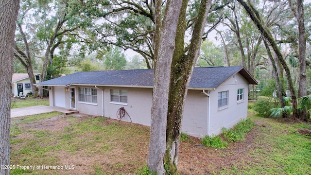 exterior space featuring a yard and a garage