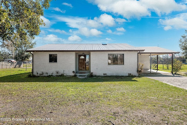 single story home featuring a front yard and a carport