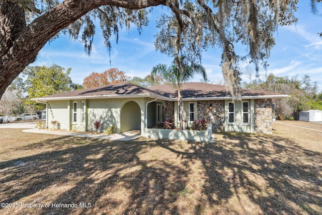 ranch-style house with a front yard