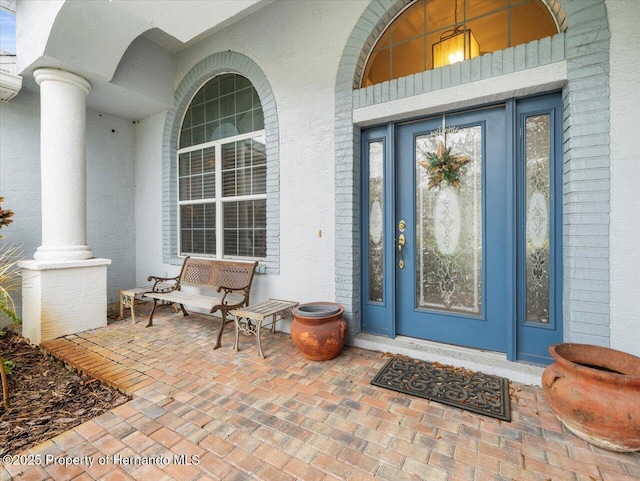 entrance to property featuring covered porch