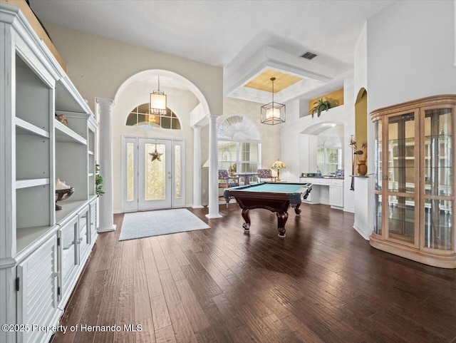 recreation room featuring pool table, dark hardwood / wood-style flooring, and decorative columns