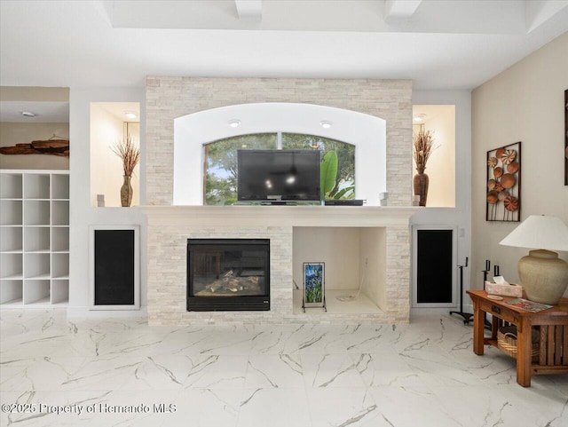 living room featuring a fireplace