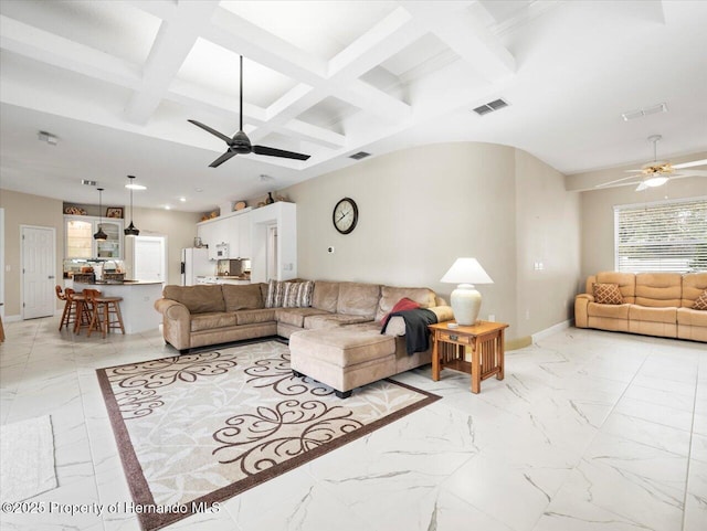 living room with beamed ceiling, ceiling fan, and coffered ceiling