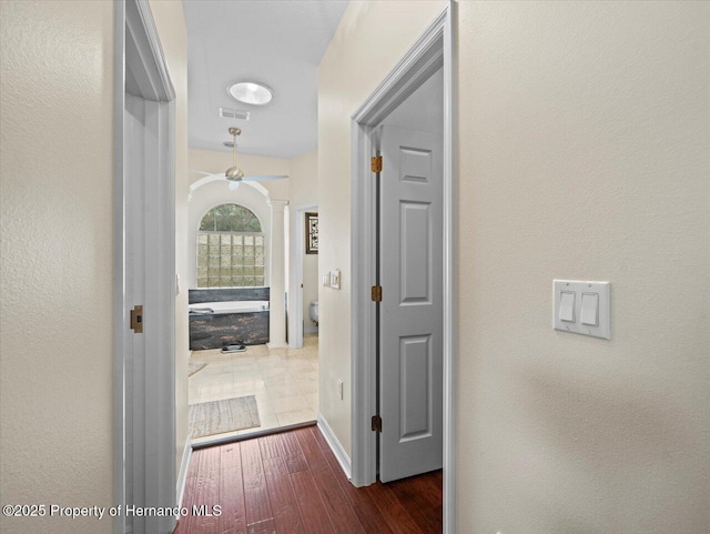 hallway featuring dark hardwood / wood-style flooring