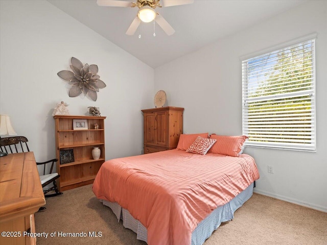 carpeted bedroom featuring ceiling fan and lofted ceiling