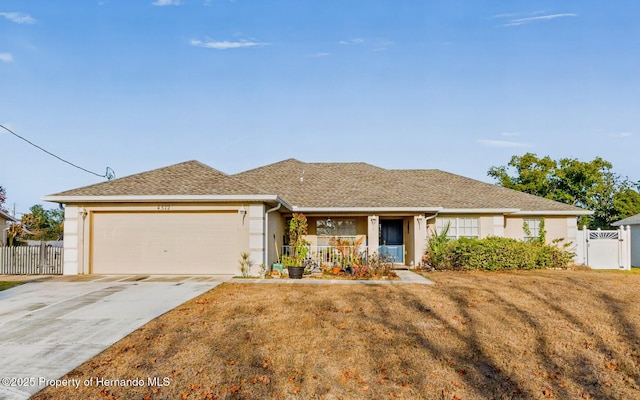 single story home featuring a garage and a front lawn