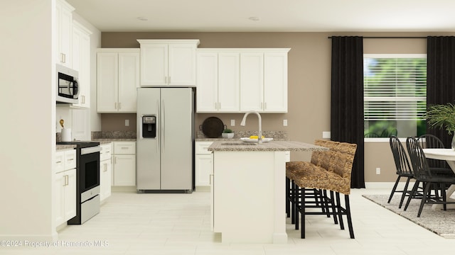 kitchen featuring white cabinetry, sink, a kitchen island with sink, and stainless steel appliances