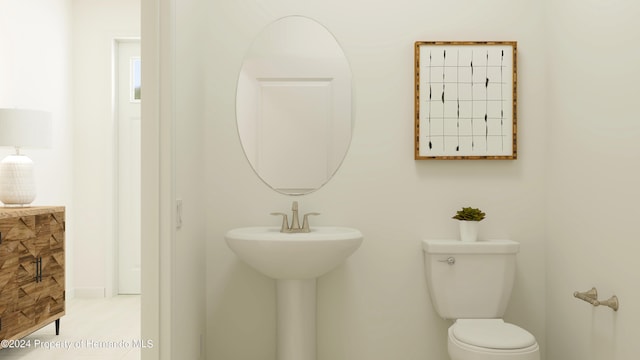 bathroom with sink and toilet