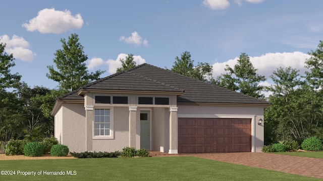 view of front facade featuring a garage and a front lawn