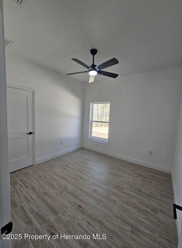 empty room featuring ceiling fan