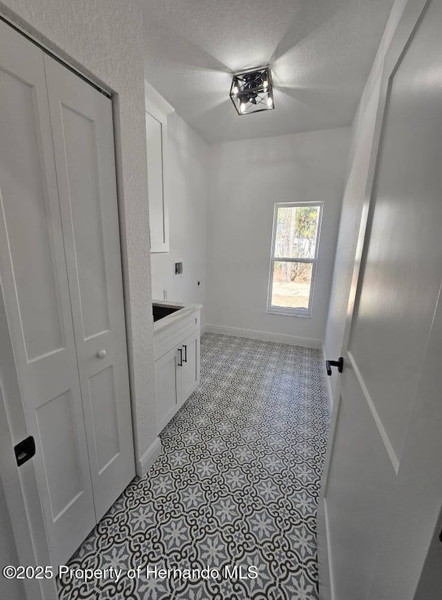 washroom with a textured ceiling