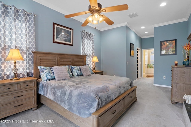 carpeted bedroom with ornamental molding, ceiling fan, and ensuite bathroom