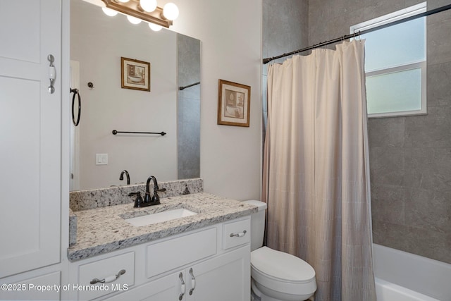 full bathroom with vanity, toilet, and shower / bath combo with shower curtain