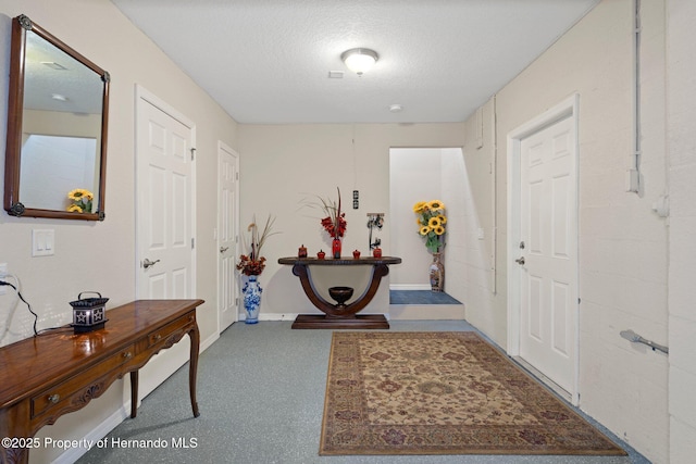 foyer featuring a textured ceiling