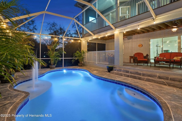 view of pool featuring outdoor lounge area, a lanai, and a patio area