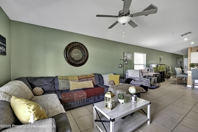 living room with ceiling fan and light tile patterned floors