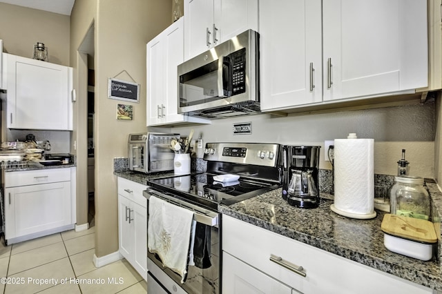 kitchen with white cabinetry and appliances with stainless steel finishes