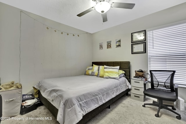 bedroom with light colored carpet and ceiling fan