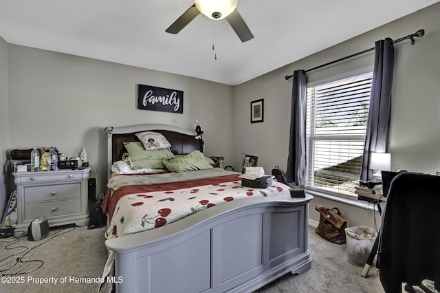 bedroom featuring ceiling fan and light colored carpet