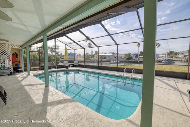 view of pool with a lanai and a patio area