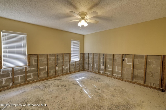 surrounding community with ceiling fan and a patio area