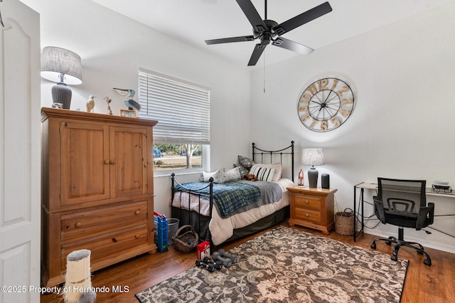 bedroom featuring hardwood / wood-style flooring and ceiling fan