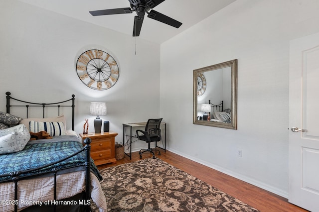 bedroom with hardwood / wood-style floors and ceiling fan